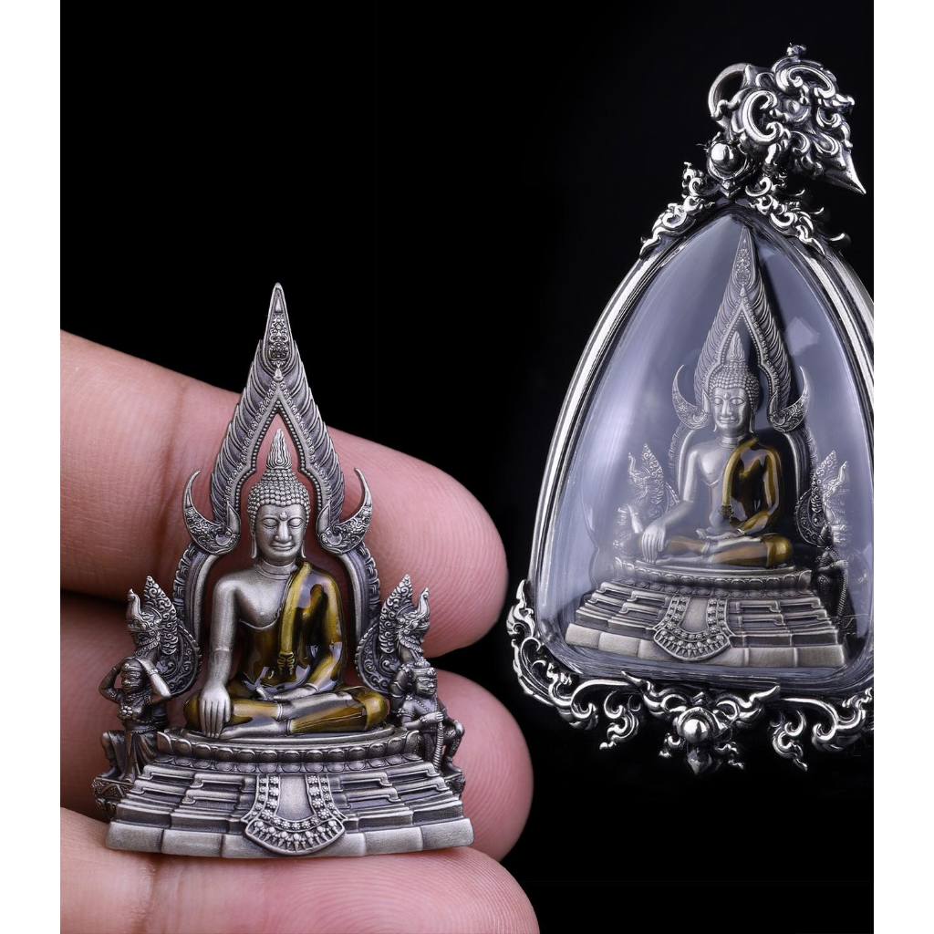 Phra Put Chinnarat amulet silver Buddha pendant with ornate case shown in hand close up by Thai Blessing Co