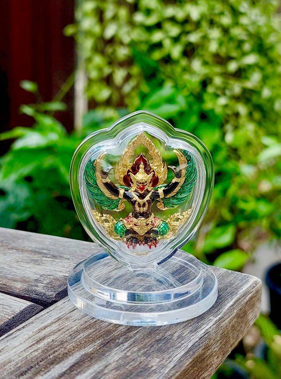 Thai Garuda car display amulet in clear heart case on round stand gold red green detailing for dashboard
