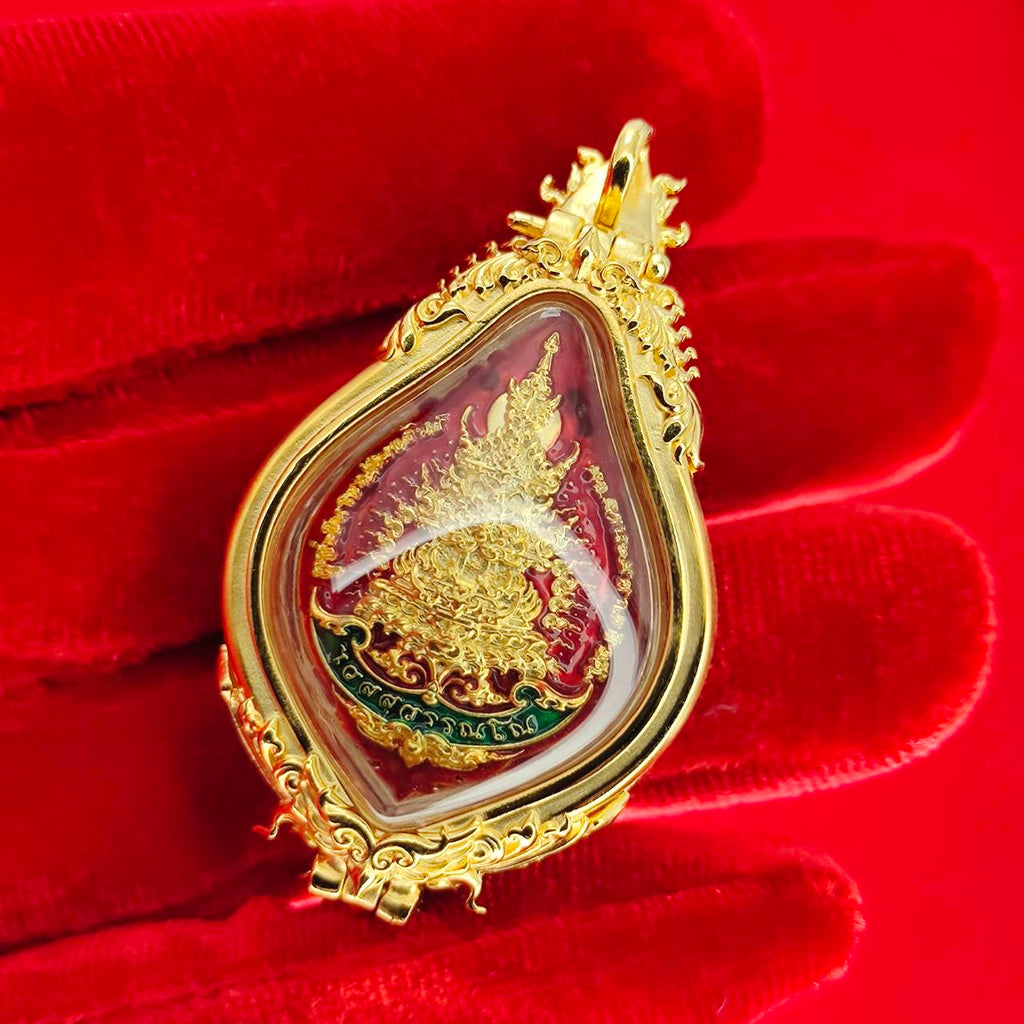 Thao Wessuwan amulet for protection with intricate gold frame and vibrant red details