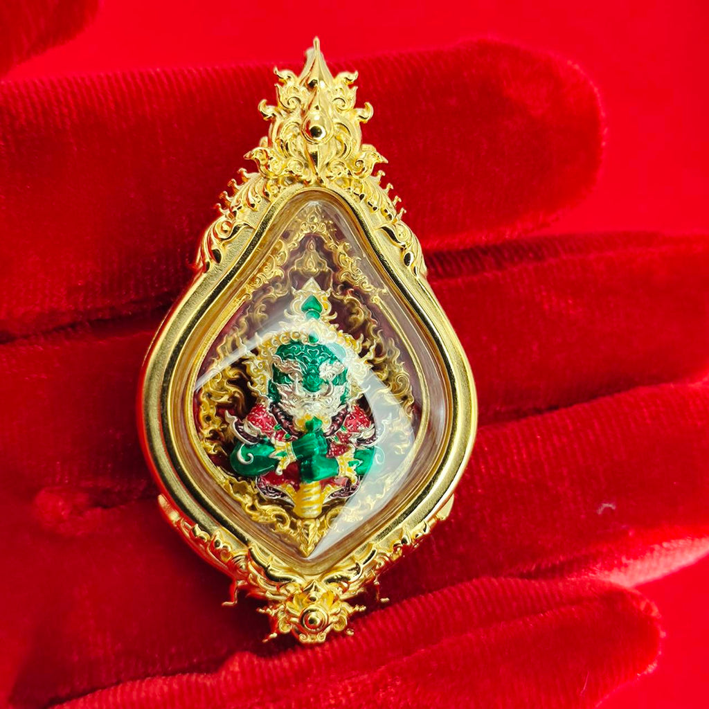 Thao Wessuwan amulet for protection in ornate golden frame, showcasing intricate details and vibrant colors