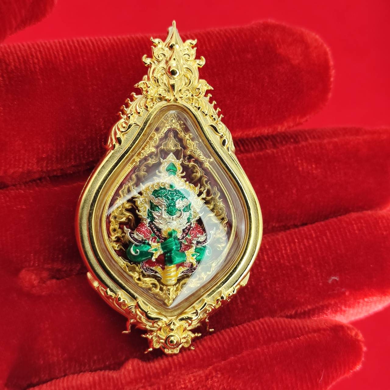 Thao Wessuwan amulet for protection in ornate golden frame, showcasing intricate details and vibrant colors