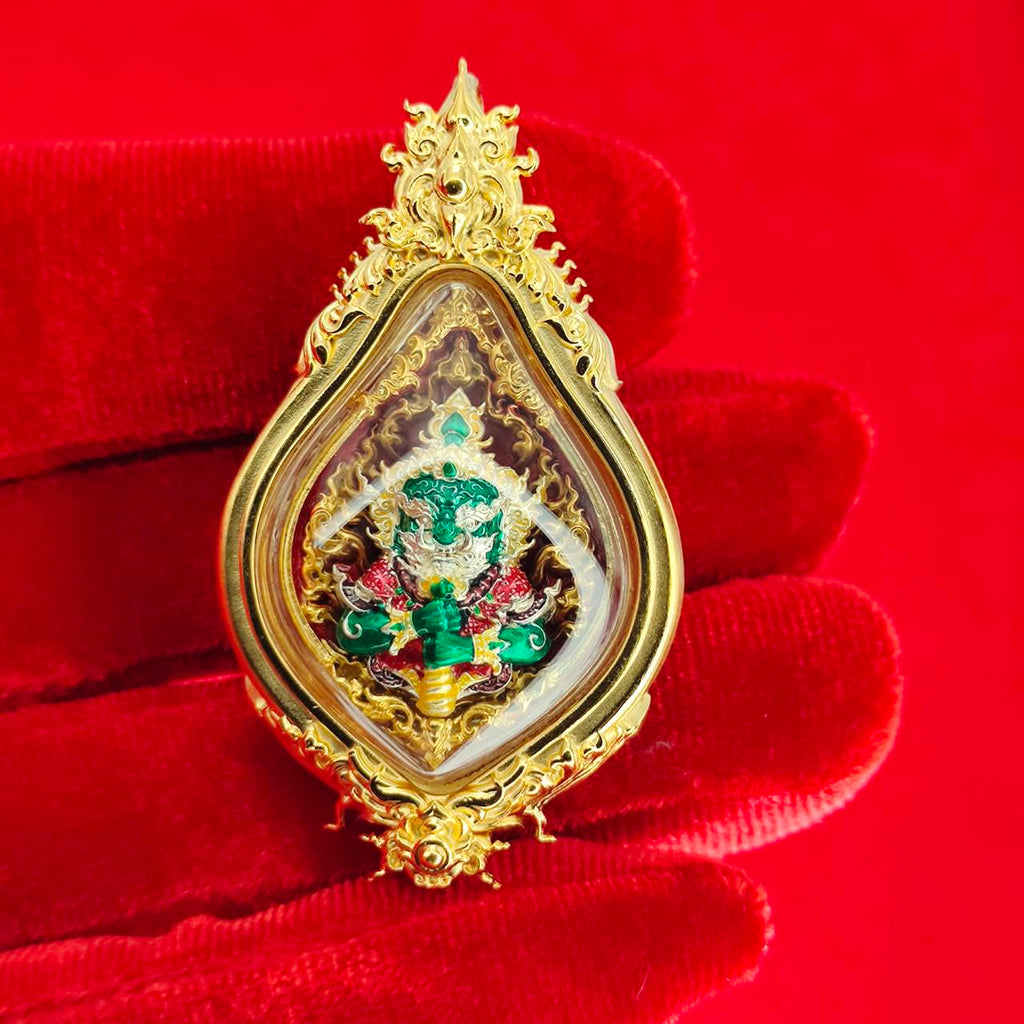 Thao Wessuwan amulet for protection encased in a golden frame with intricate details