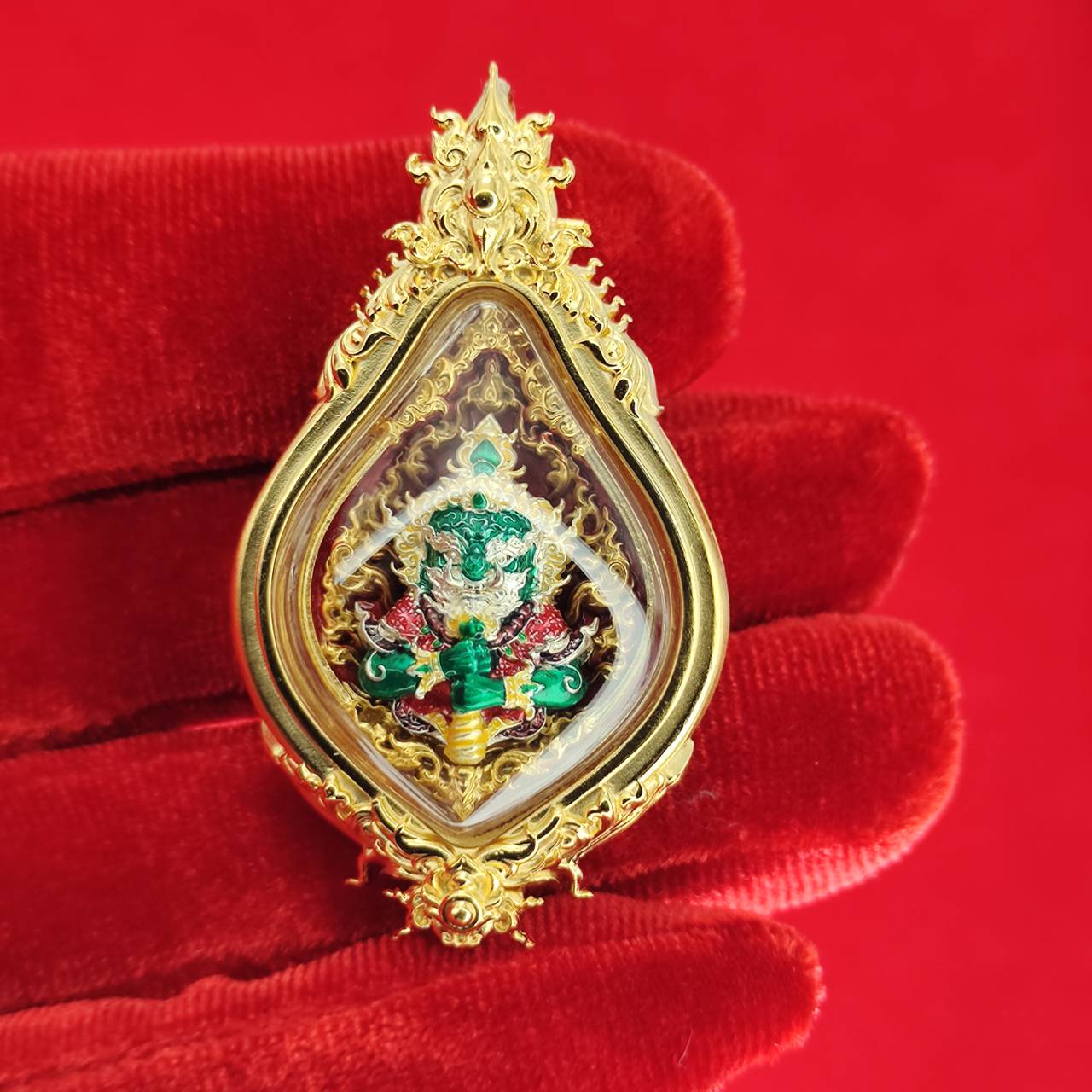 Thao Wessuwan amulet for protection encased in a golden frame with intricate details