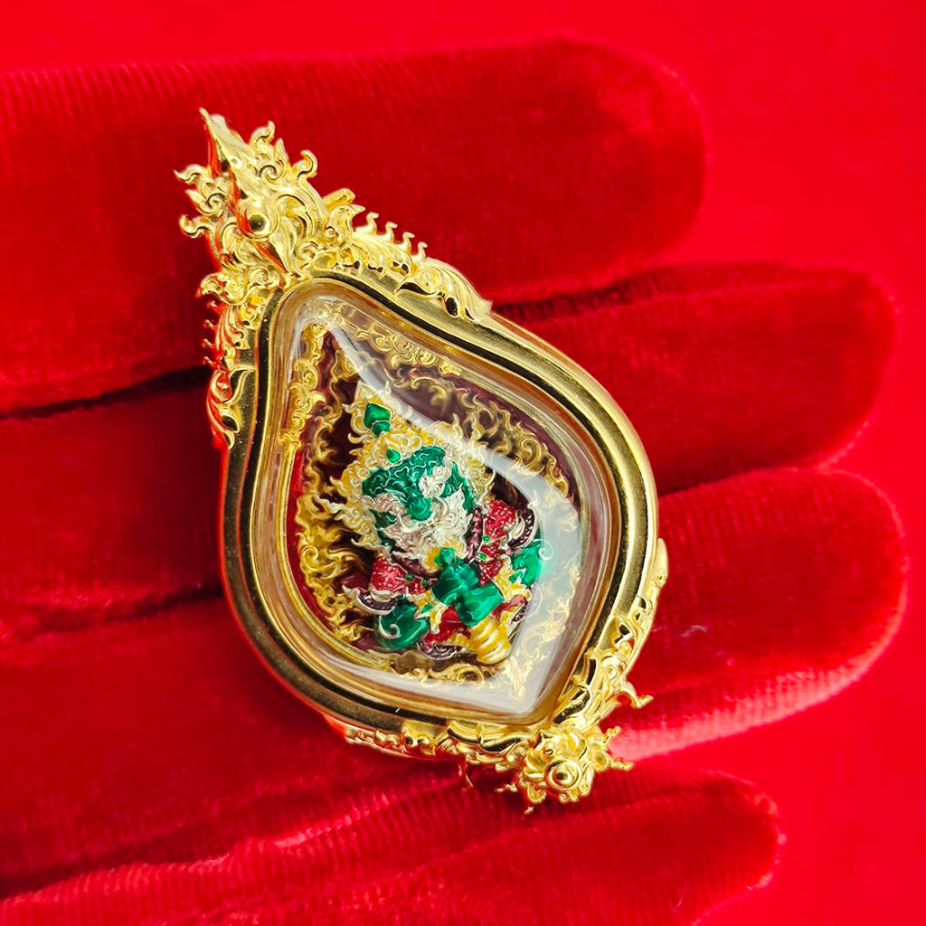 Thao Wessuwan amulet for protection in ornate gold casing with detailed craftsmanship