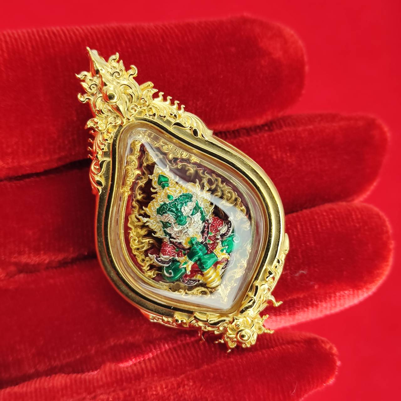 Thao Wessuwan amulet for protection in ornate gold casing with detailed craftsmanship