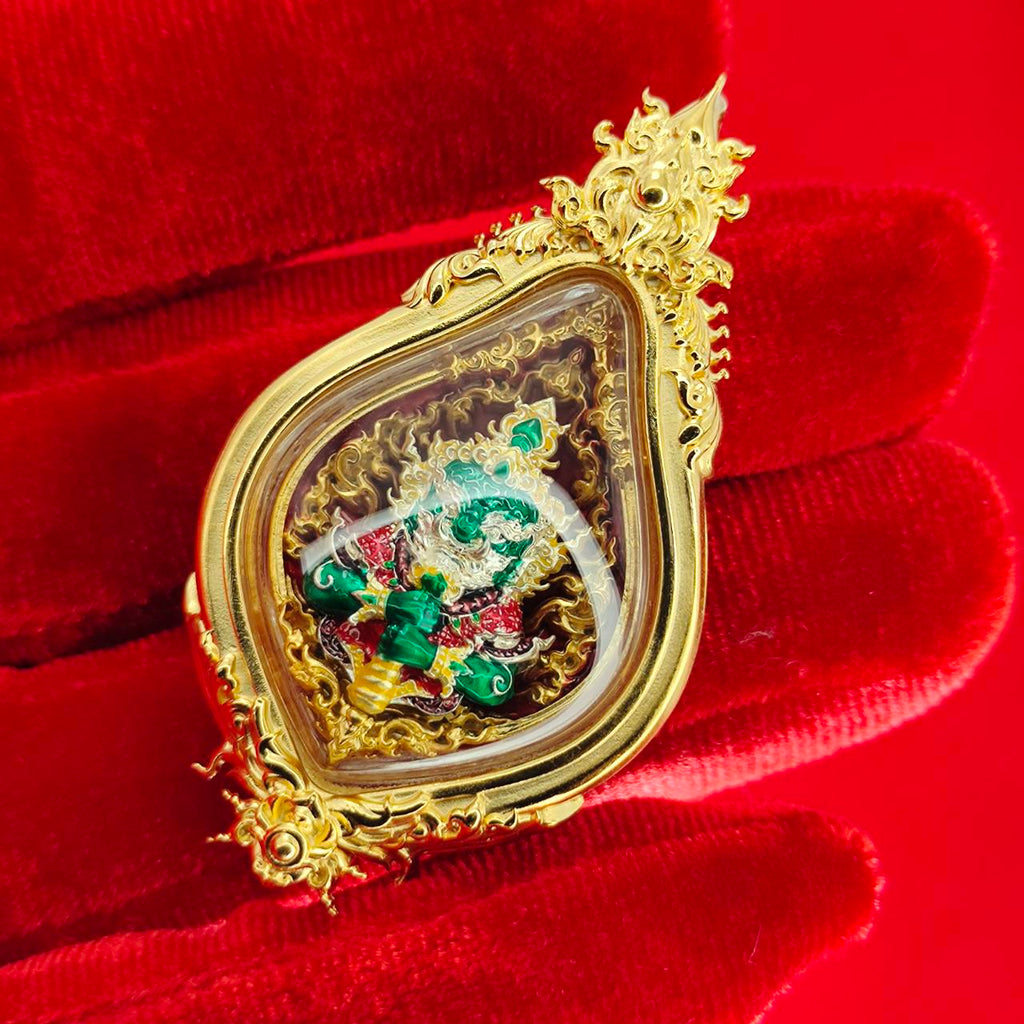 Thao Wessuwan amulet for protection encased in ornate gold frame with vibrant colors
