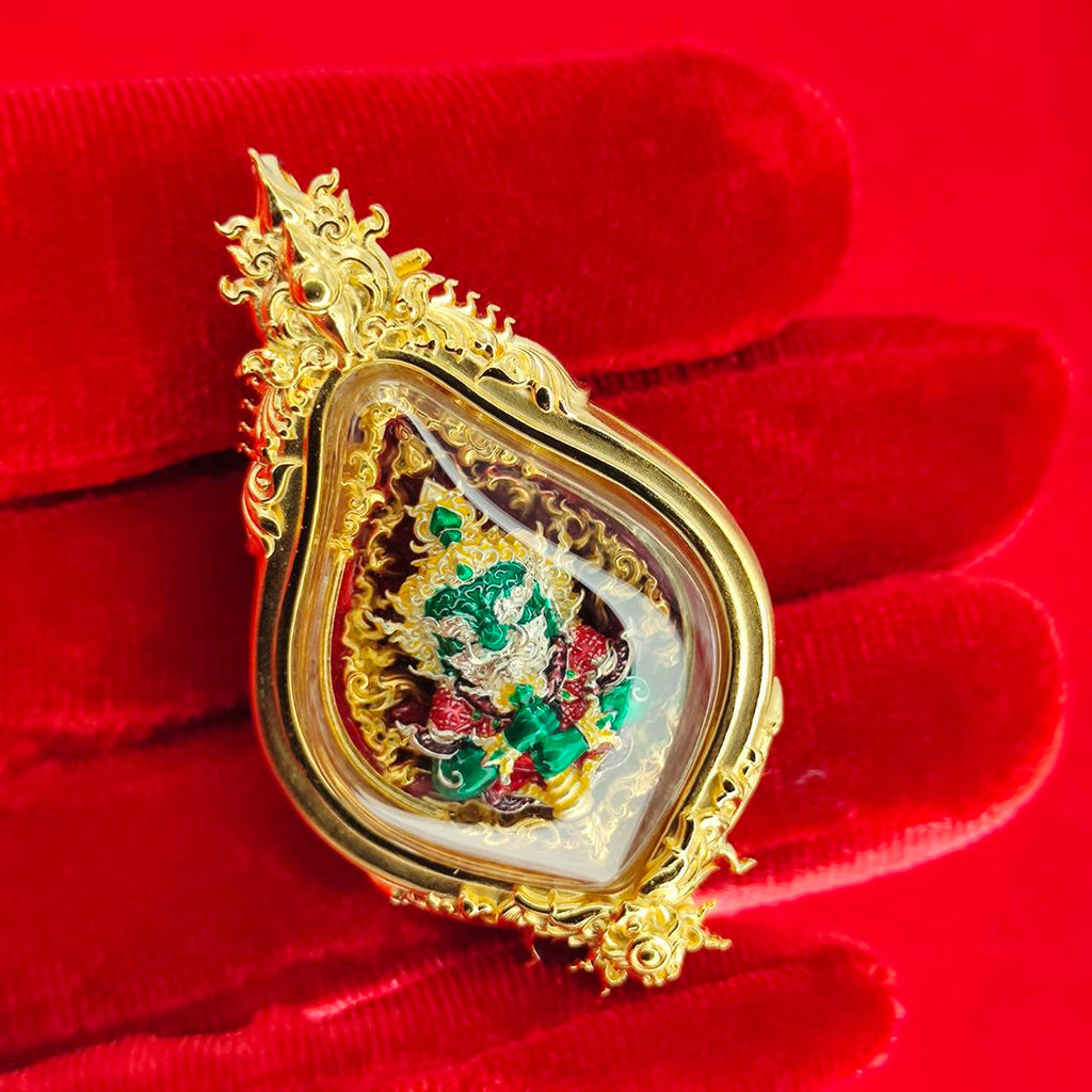 Thao Wessuwan amulet for protection in elegant casing, displayed on red velvet background by Thai Blessing Co