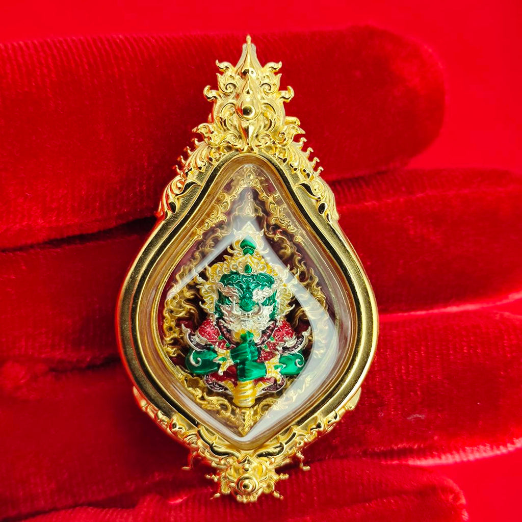 Gold-plated Thao Wessuwan amulet for protection with intricate design and vibrant colors