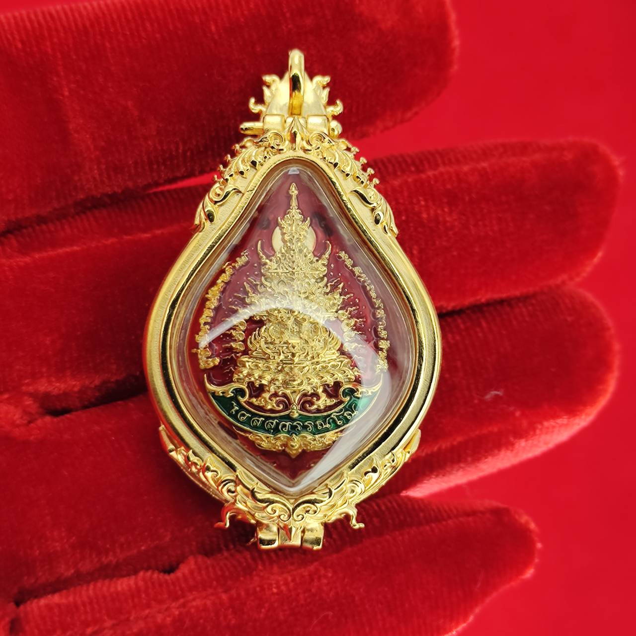 Gold Thao Wessuwan amulet for protection, intricately designed with vibrant colors and detailed features