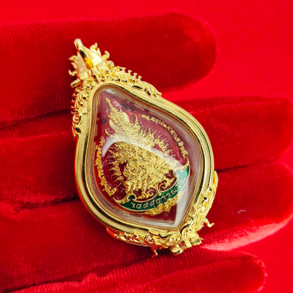Thao Wessuwan amulet for protection in a gold pendant with intricate detailing and vibrant colors