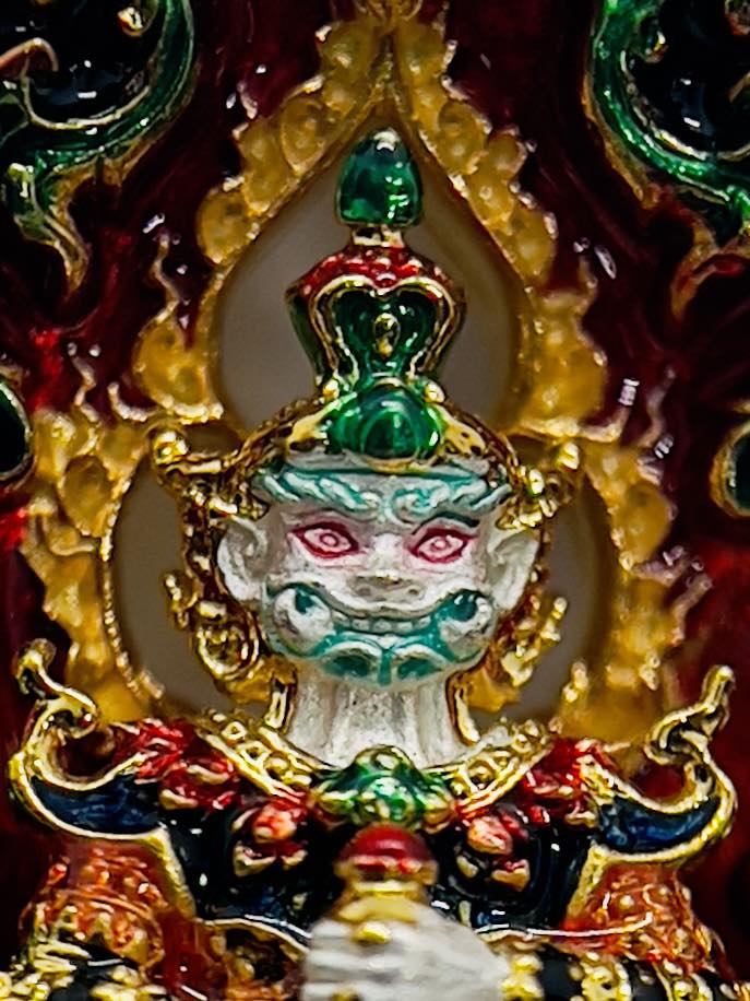 Colorful Thao Wessuwan amulet for protection with intricate detailing and traditional Thai design