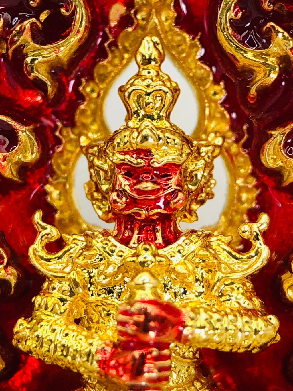 Thao Wessuwan amulet for sale in vibrant red and gold with intricate details and craftsmanship