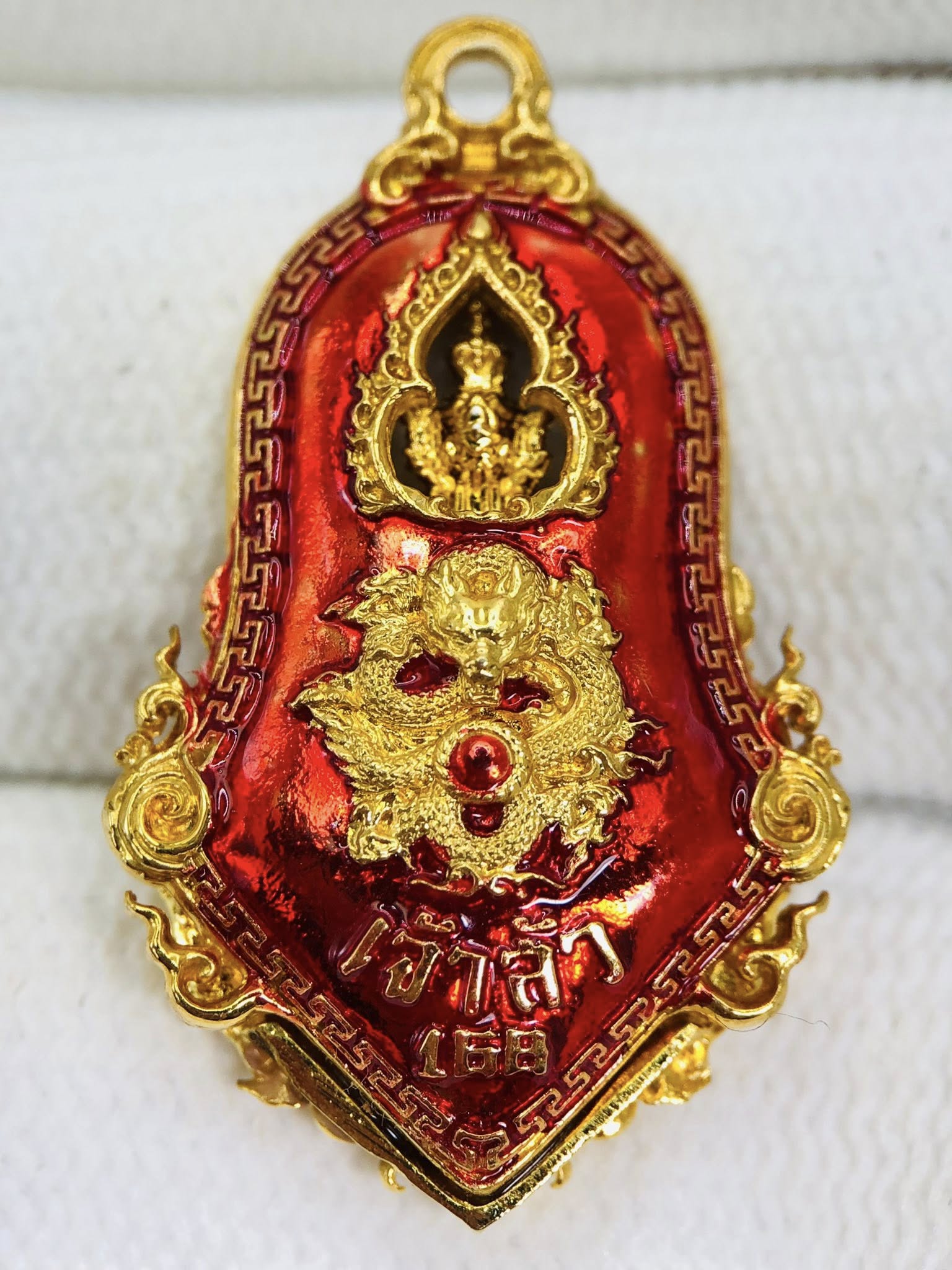 Thao Wessuwan amulet for sale with vibrant red design and golden detailing for protection and prosperity