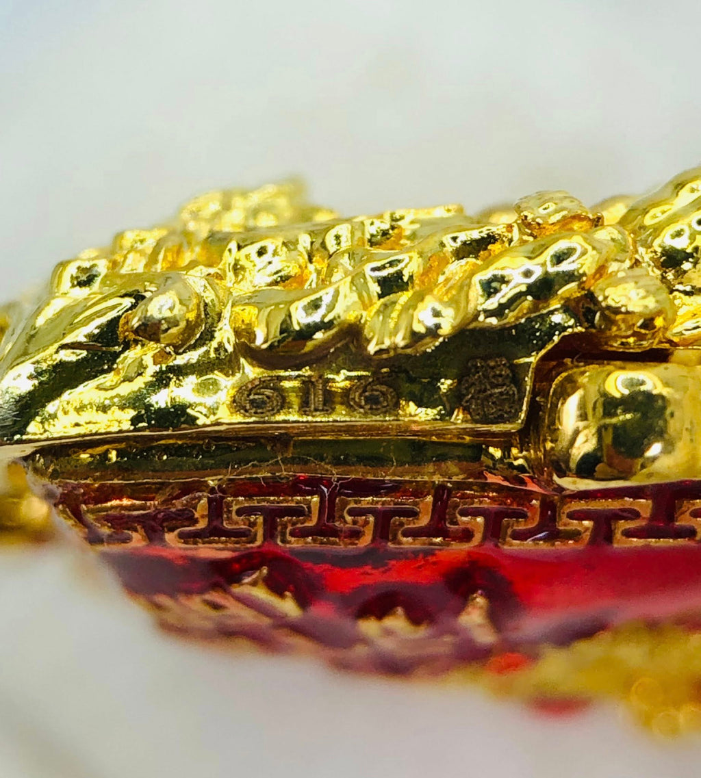 Close-up of Thao Wessuwan amulet for sale featuring intricate gold detailing and vibrant colors