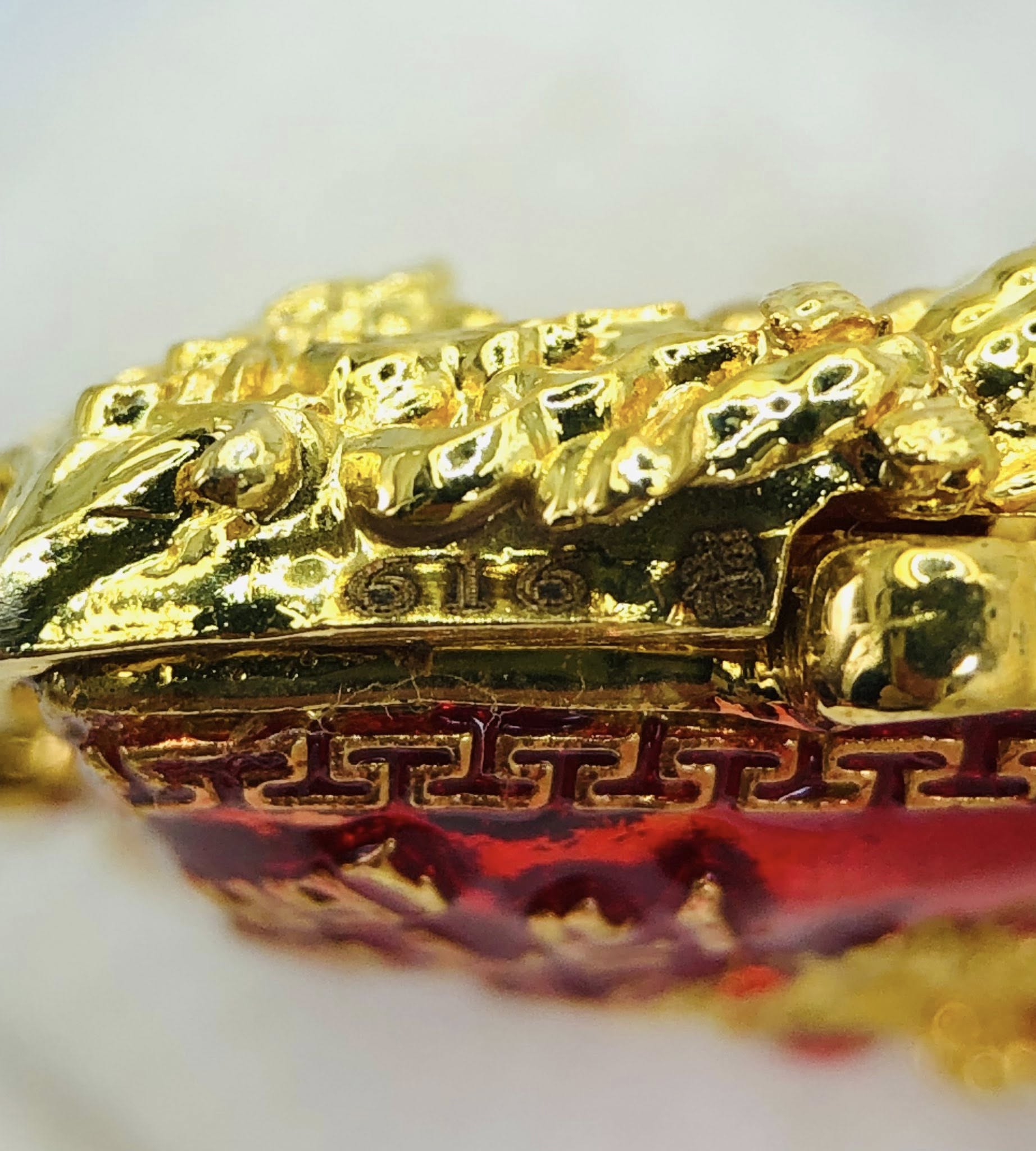 Close-up of Thao Wessuwan amulet for sale featuring intricate gold detailing and vibrant colors