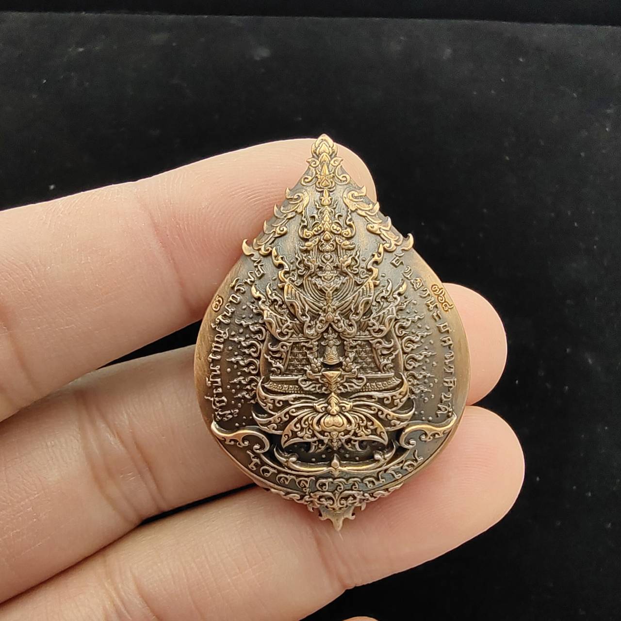 Thao Wessuwan amulet for wealth made with intricate details and a unique design, held in hand