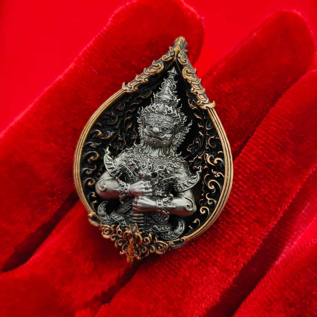 Thao Wessuwan amulet for wealth featuring intricate design and black and gold details