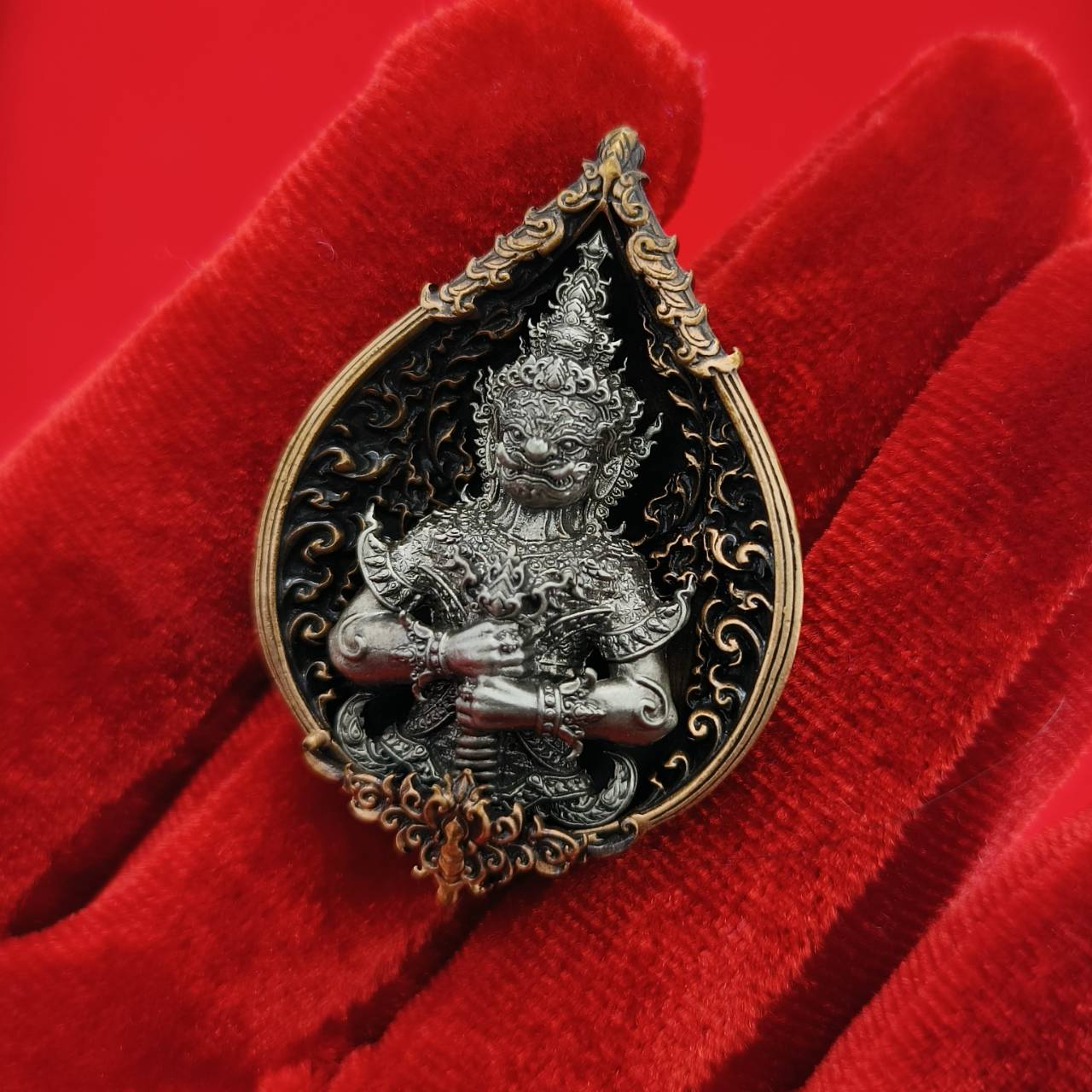 Thao Wessuwan amulet for wealth featuring intricate design and black and gold details