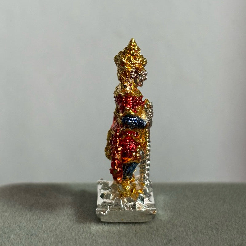 Side view of Thai Blessing Co Thao Wessuwan amulet Thailand with gold and red detailing