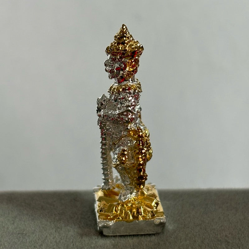 Thao Wessuwan collectible amulet in gold and silver tones standing on a square base from Thai Blessing Co