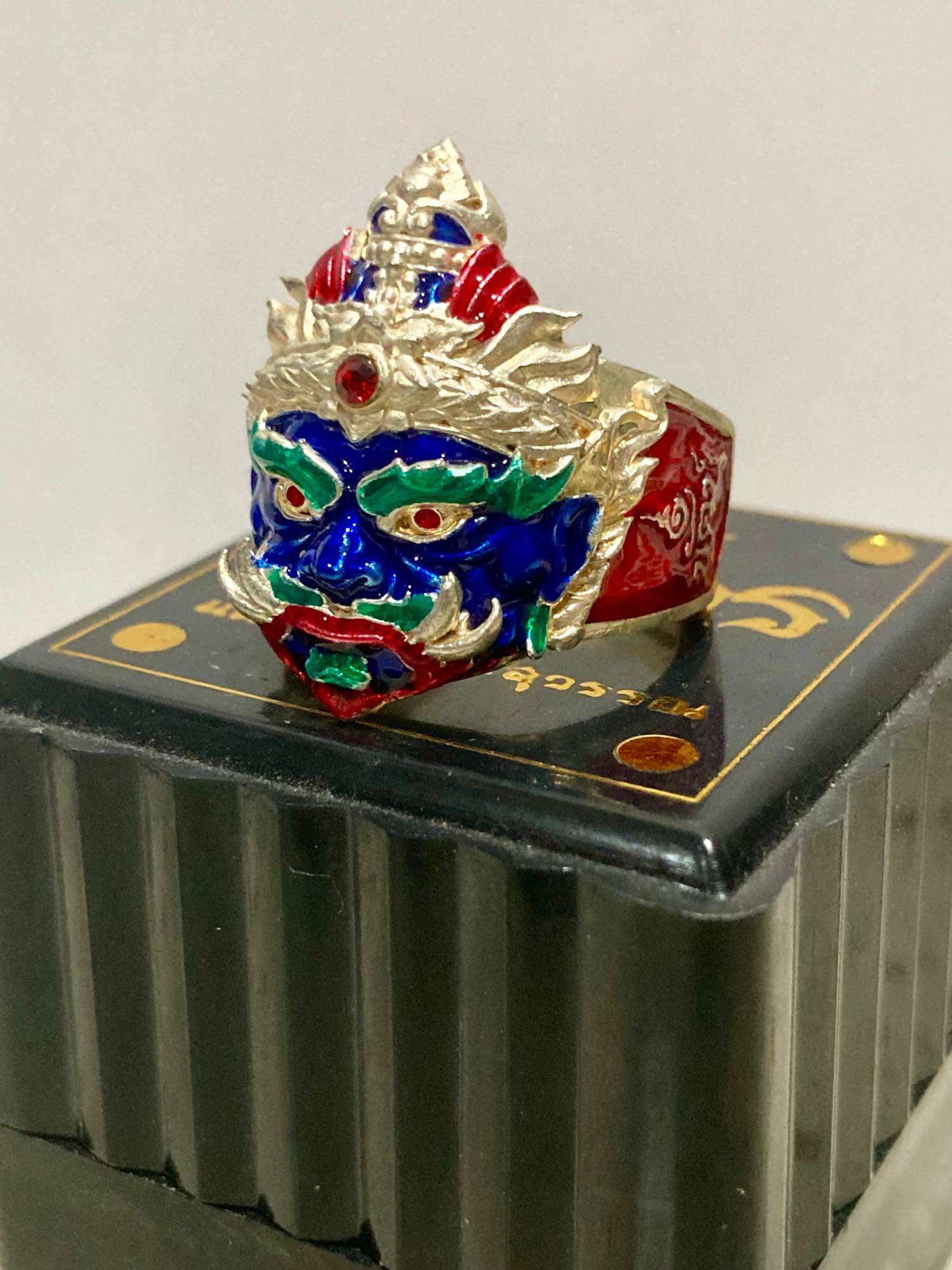 Thao Wessuwan protection ring with colorful detailing and intricate design on a decorative box