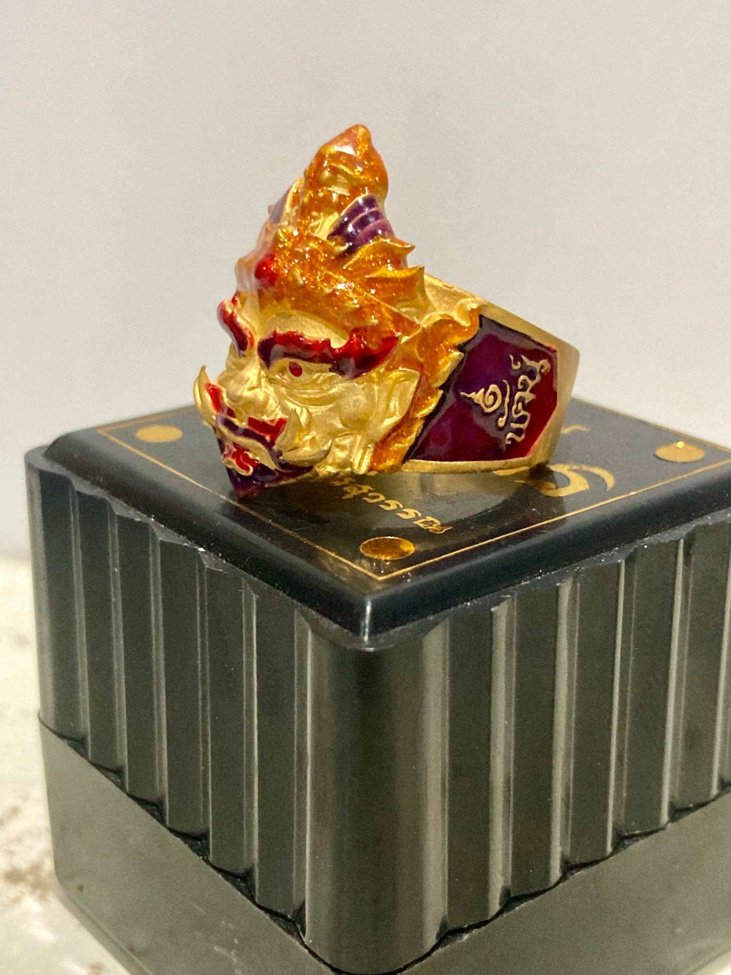 Thao Wessuwan protection ring with intricate golden design and colorful accents for spiritual protection