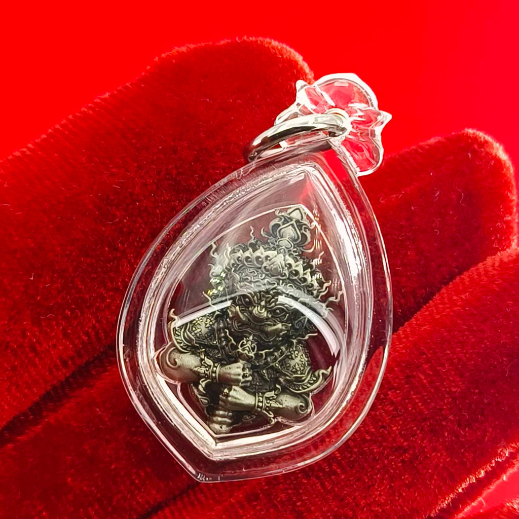 Thao Wessuwanno amulet encased in clear resin, showcasing intricate details and craftsmanship