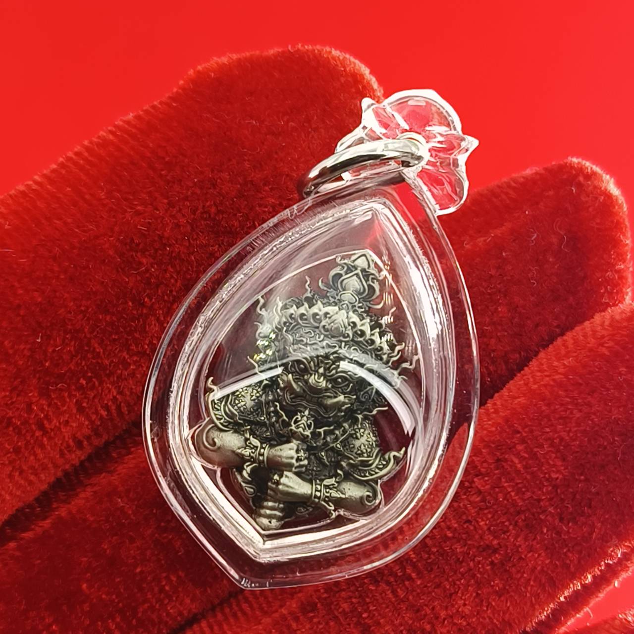 Thao Wessuwanno amulet encased in clear resin, showcasing intricate details and craftsmanship