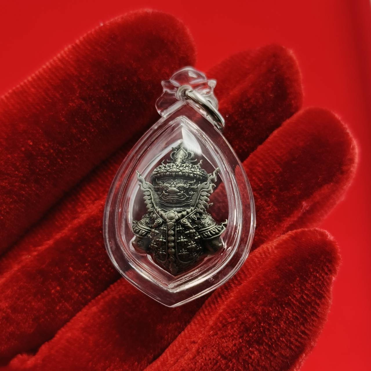 Thao Wessuwanno amulet encased in clear protective casing with intricate details and design