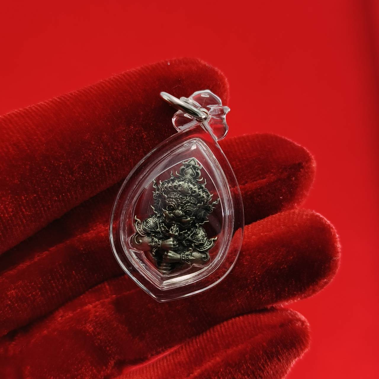 Thao Wessuwanno amulet enclosed in clear casing, designed for spiritual protection and decoration