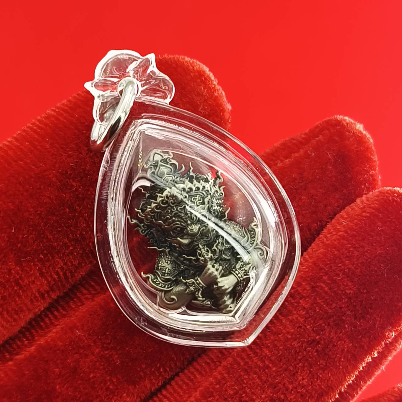 Thao Wessuwanno amulet encased in clear protective casing, featuring intricate details and craftsmanship