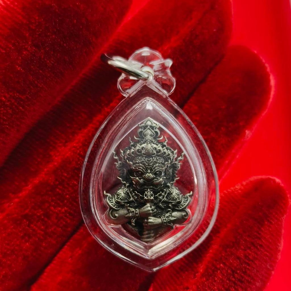 Thao Wessuwanno amulet in a clear protective casing, detailed design showcasing its spiritual significance