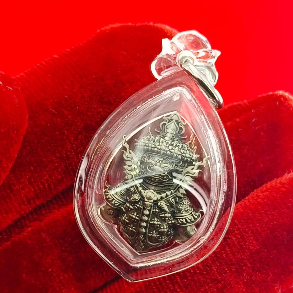 Thao Wessuwanno amulet encased in clear protective resin, featuring intricate details on the figure's attire