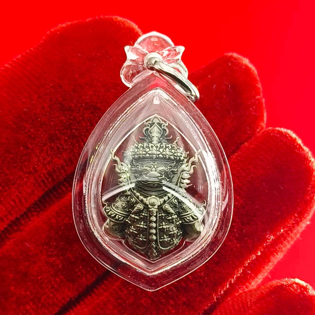 Thao Wessuwanno amulet encased in clear protective casing with intricate detailing and ornate design