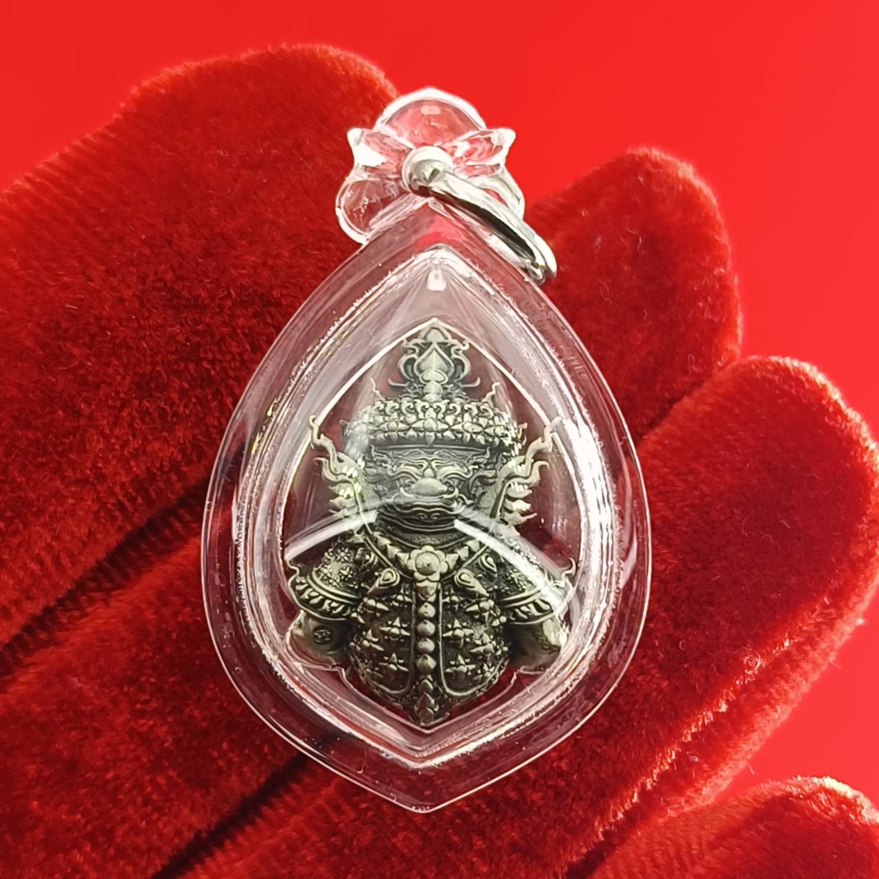 Thao Wessuwanno amulet encased in clear protective casing with intricate detailing and ornate design