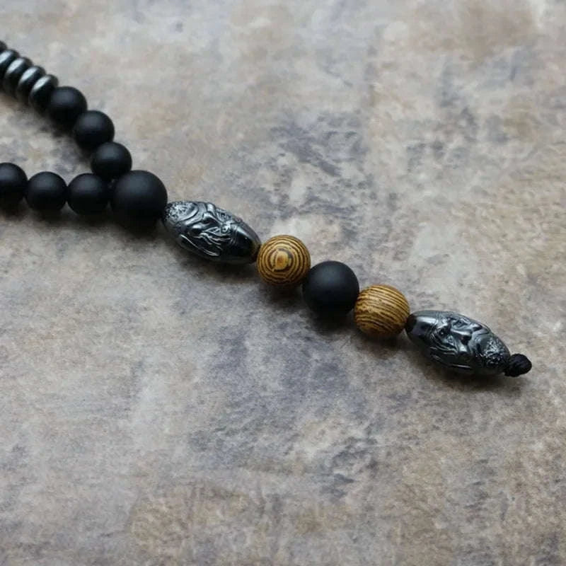 🗿 The "Ancestral Sage" Necklace: 6mm Hematite & Carved Tribal Elder Head Pendant (Wisdom & Protection)