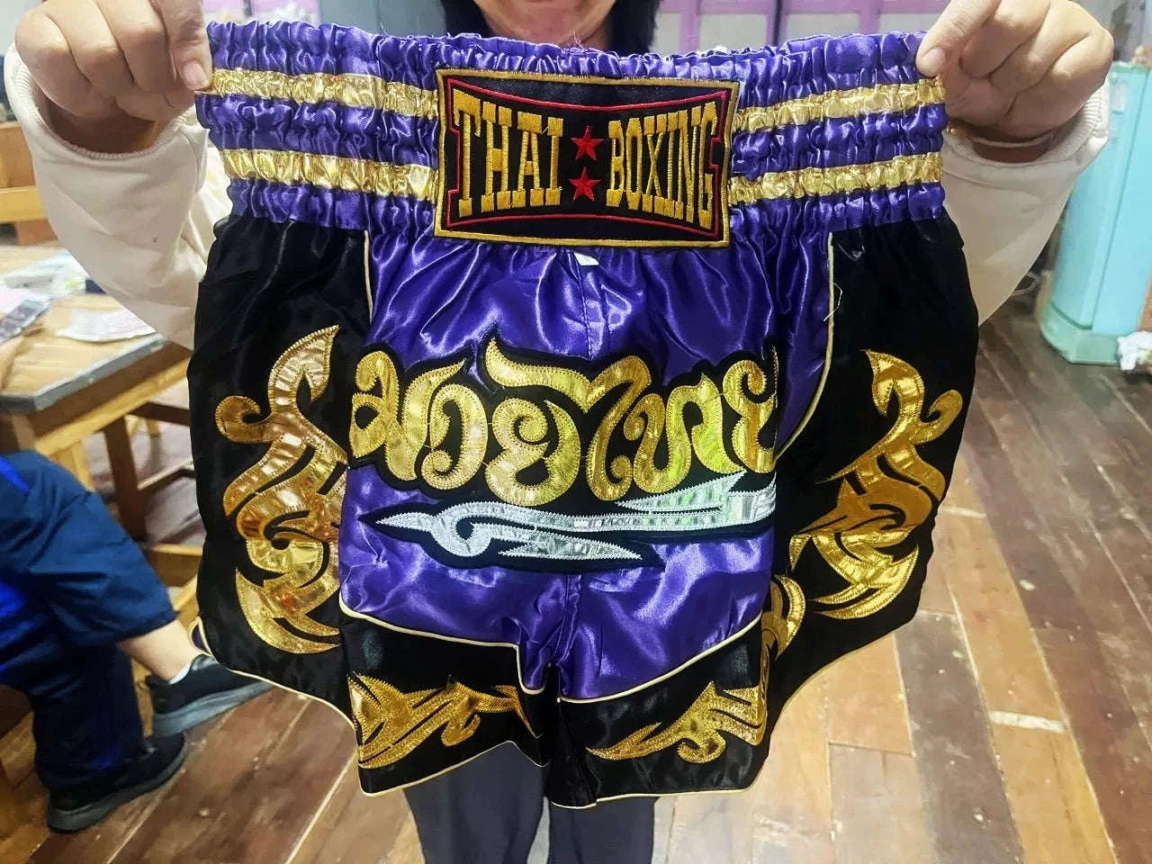 🥊The Warrior’s Glory: Authentic Premium Thai Pattern Muay Thai Shorts – Double-Layered Professional Satin Boxing Trunks, Handcrafted Factory-Direct Export Grade for Adults and Kids (Purple and black Muay Thai shorts)