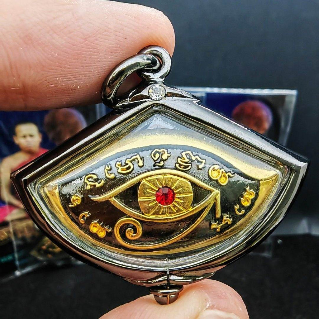 Third eye amulet for protection featuring intricate designs and a red gem, ideal for spiritual defense