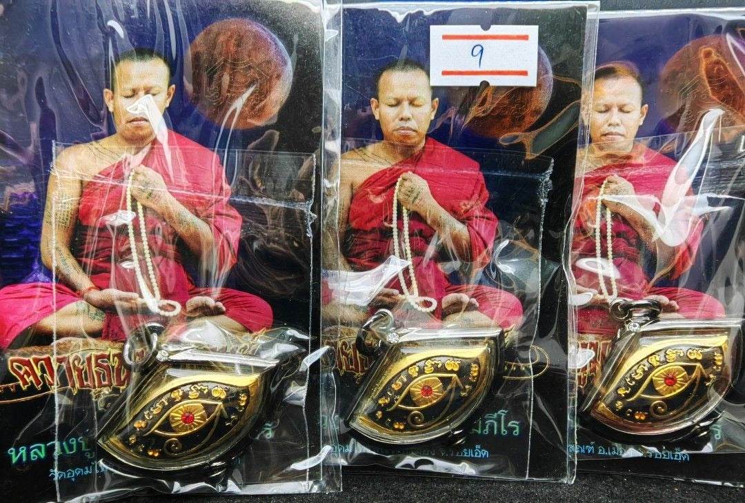 Third eye amulet for protection featuring a monk meditating, packaged for spiritual use
