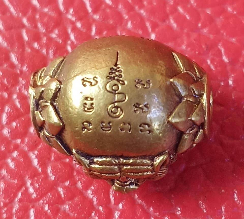 Tiger Guardian Amulet Thailand with traditional inscriptions on a bronze surface by Thai Blessing Co