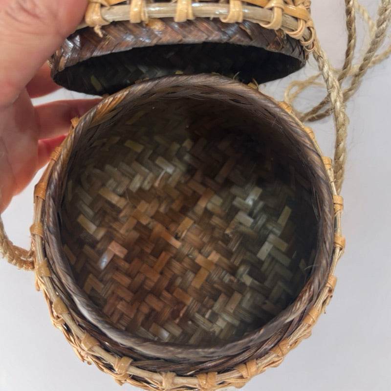 Open traditional Thai storage box made of woven natural materials by One-Sake.com