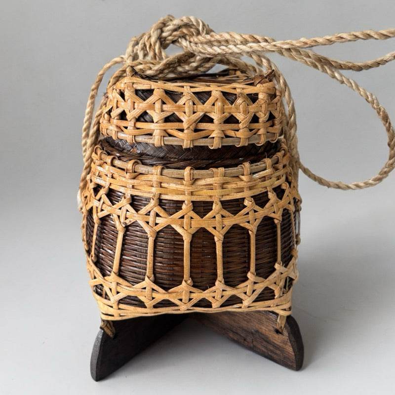 One-Sake traditional Thai storage box made of woven wood with a rope handle and wooden base