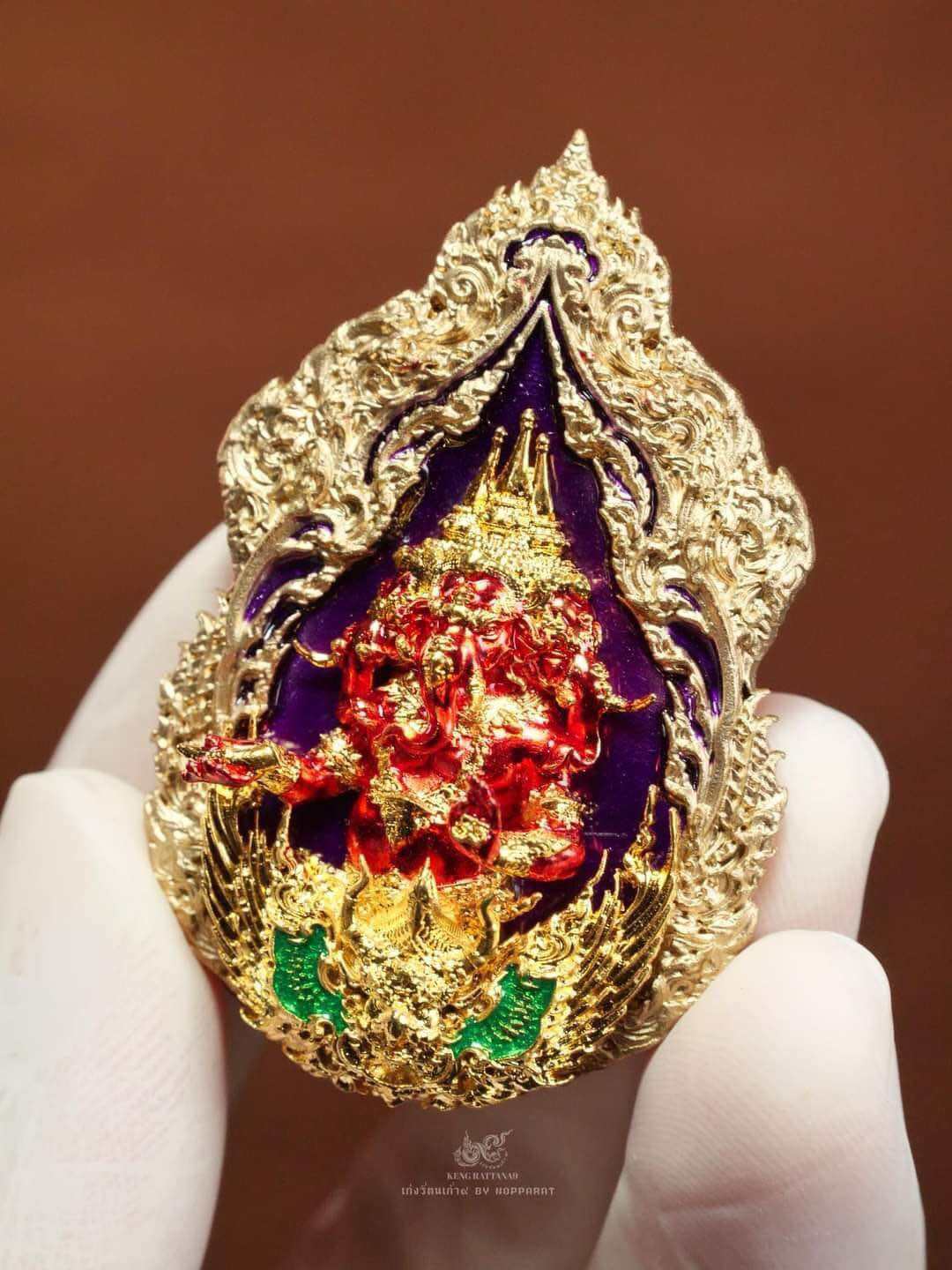 Trimurti Ganesha medallion for luck with intricate gold and red detailing, perfect for decor or spiritual use