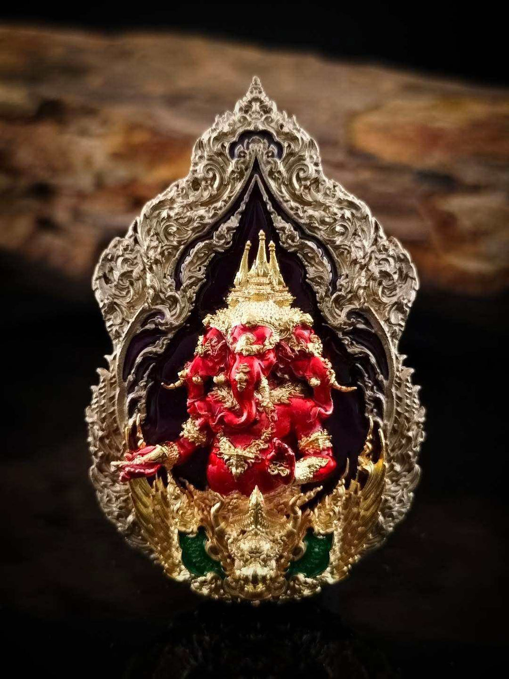 Intricate Trimurti Ganesha medallion for luck featuring vibrant colors and detailed craftsmanship