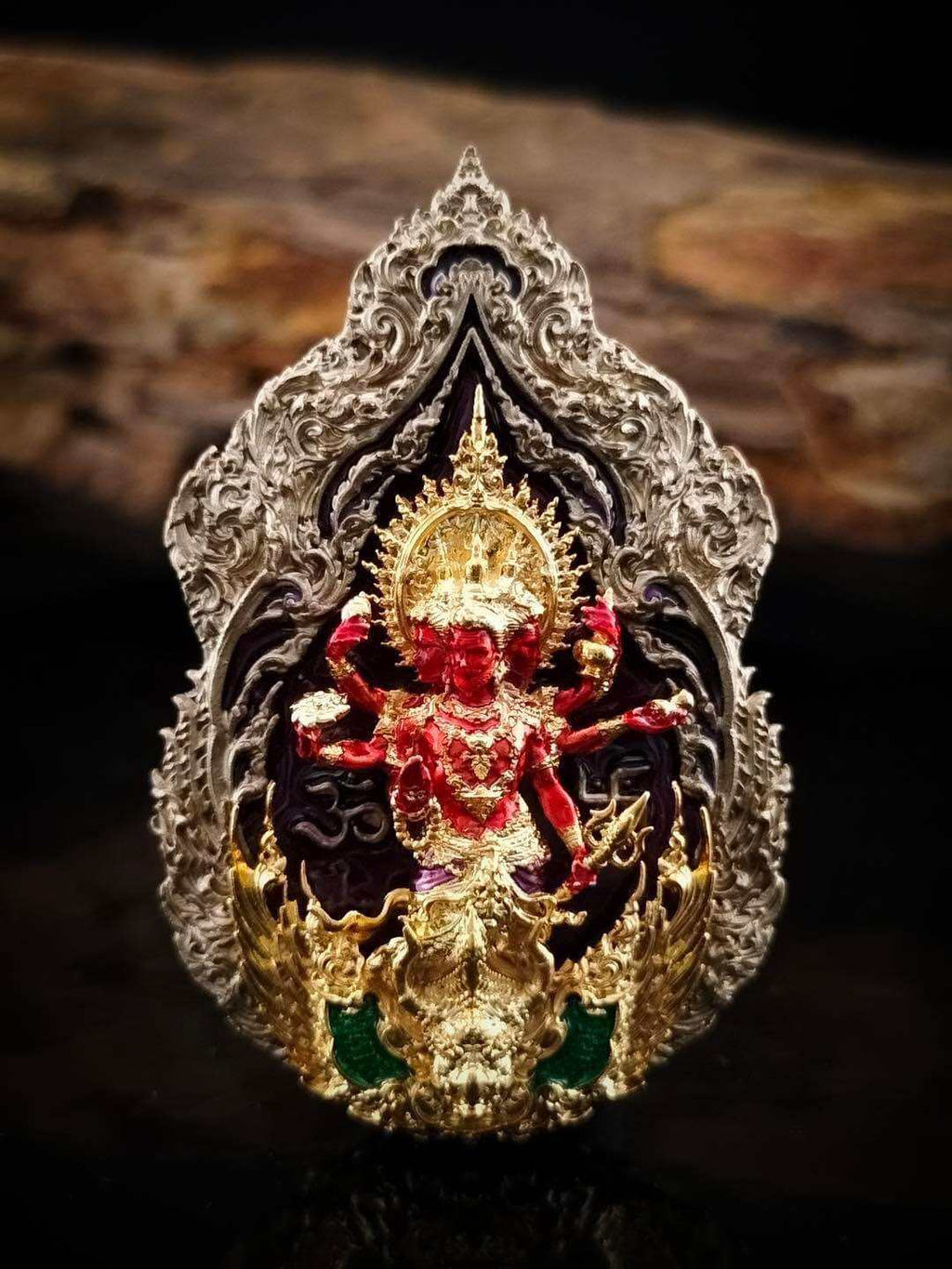Trimurti Ganesha medallion for luck in intricate silver design with vibrant details