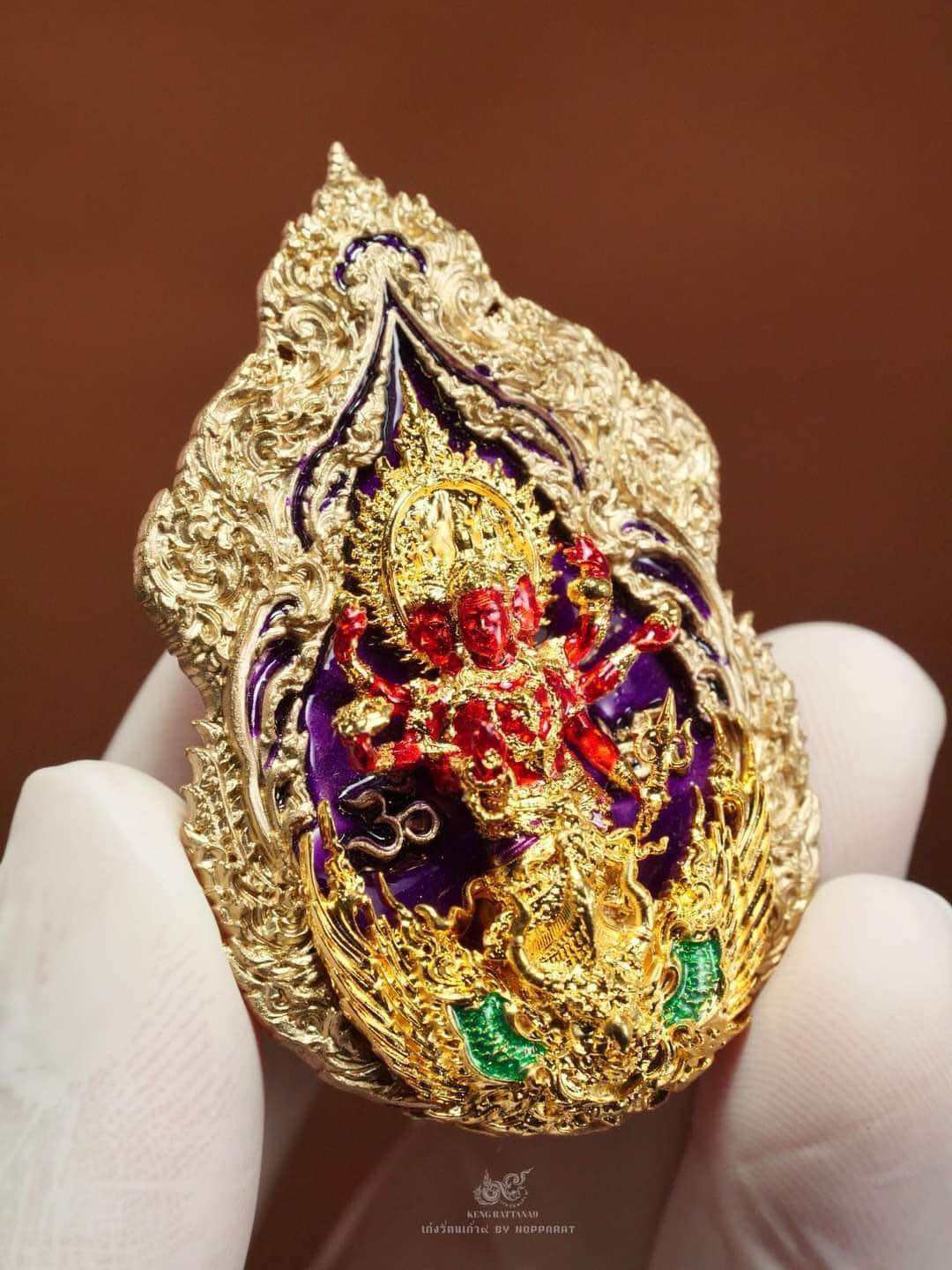 Trimurti Ganesha medallion for luck, intricately designed with vibrant colors and detailed craftsmanship