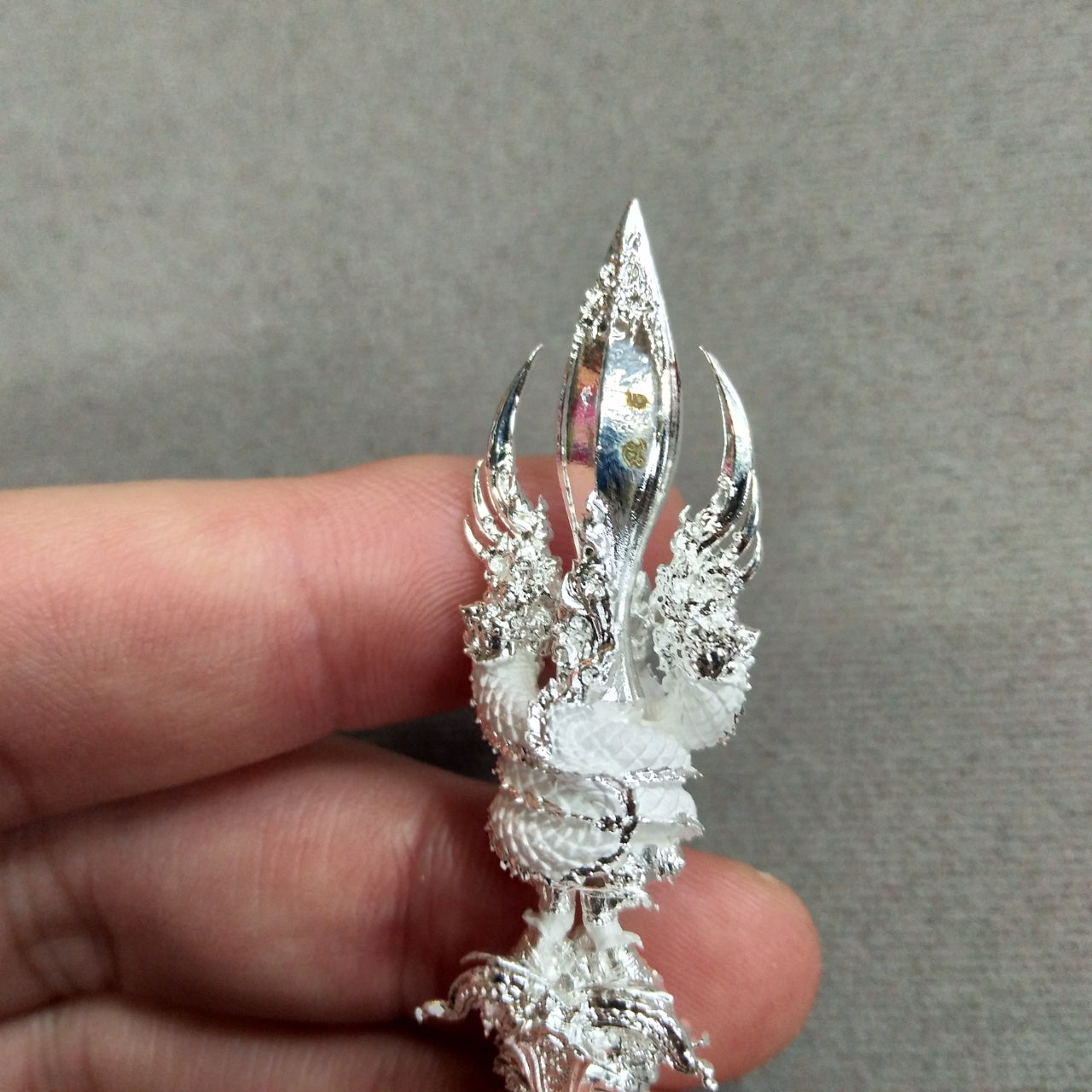 Handcrafted Vajra Wessuwan amulet for wealth featuring intricate silver details and design