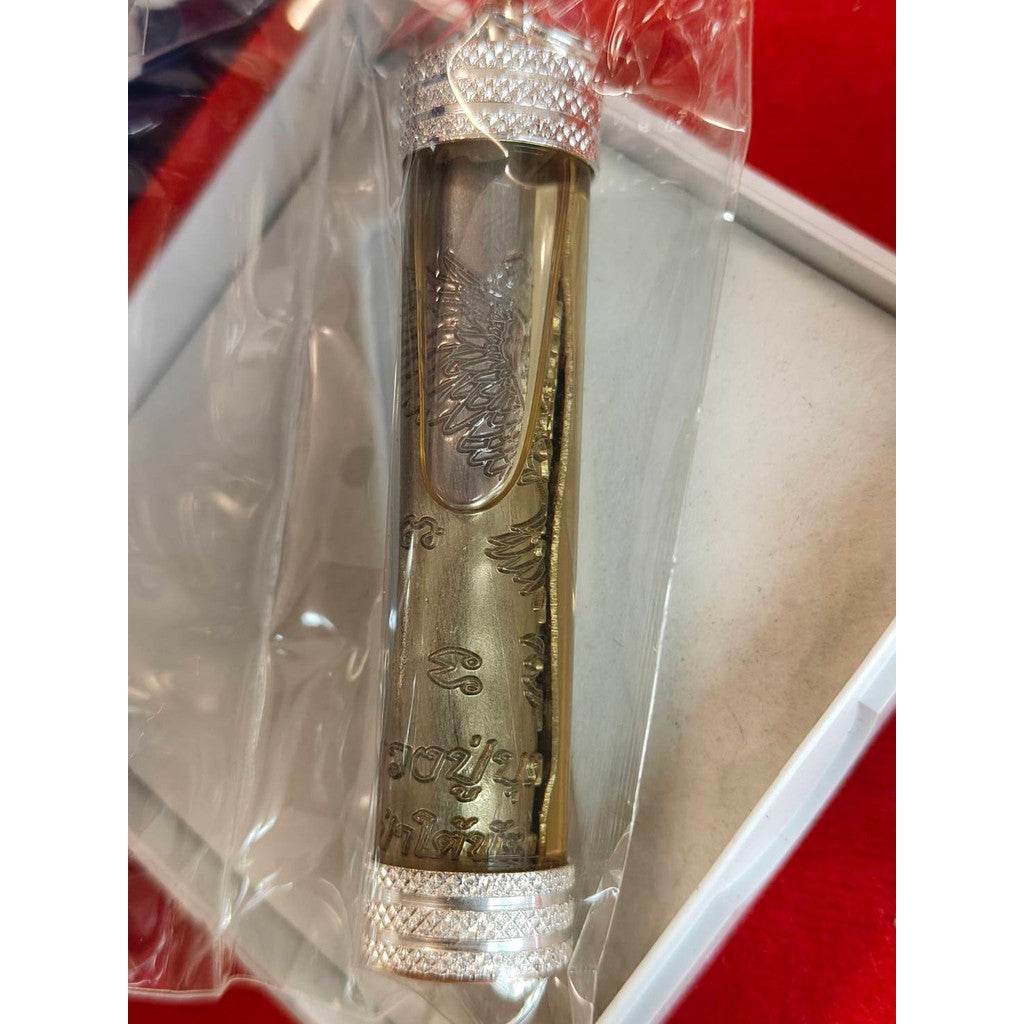 Takrut Phaya Nok Thued Thue amulet in protective plastic casing with silver decorative ends by Thai Blessing Co