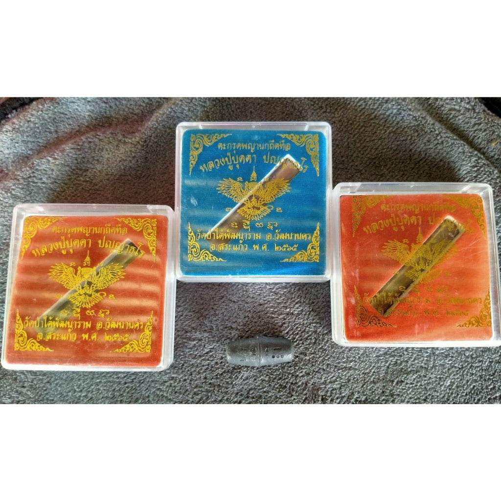 Takrut Phaya Nok Thued Thue amulet in protective cases with Thai blessing inscriptions from Thai Blessing Co