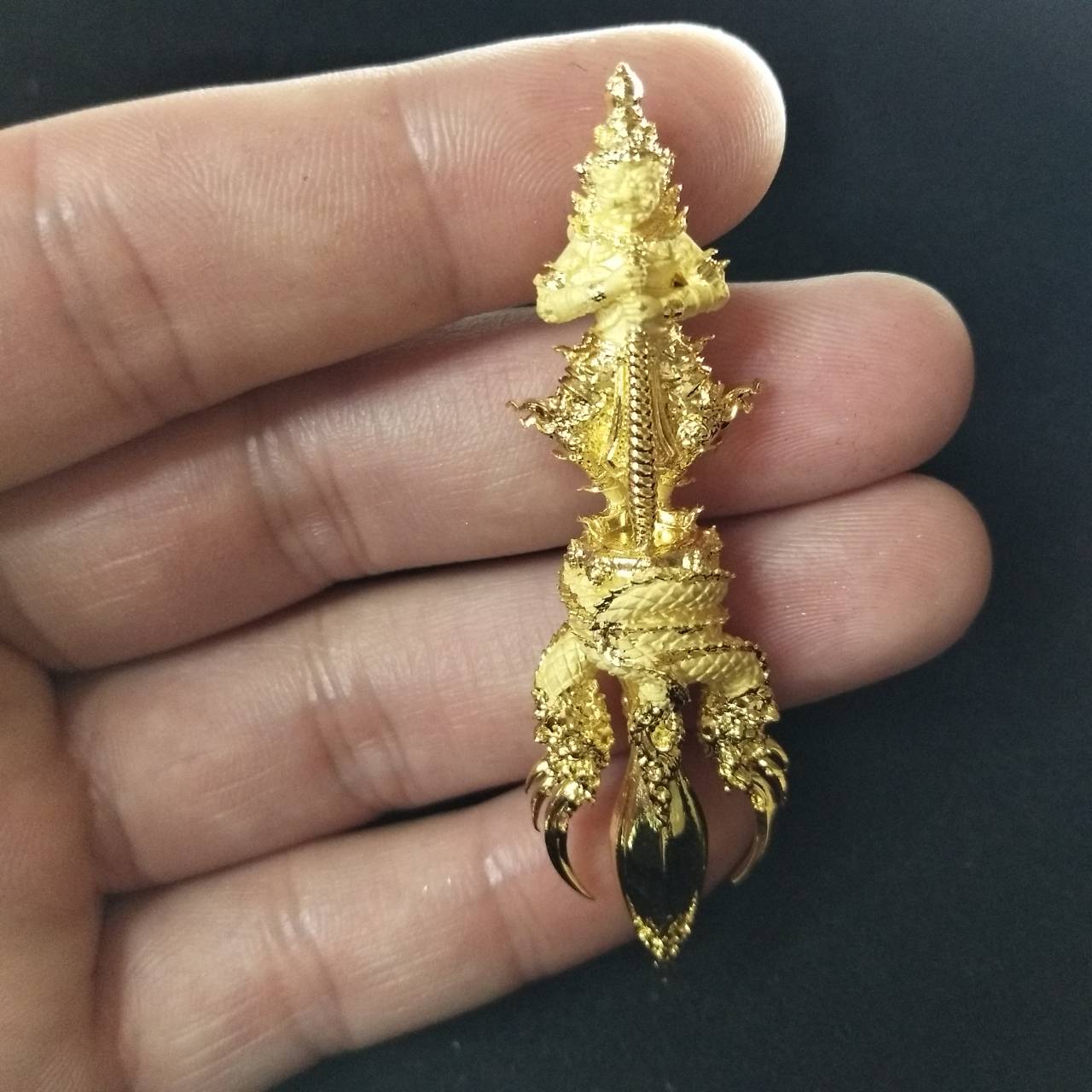 Vessuwan amulet for wealth in gold, intricately designed and easy to hold in hand for prosperity seekers